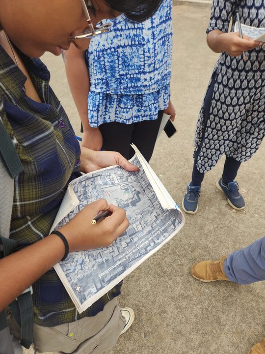 A student from Srishti Interim annotates a map during fieldwork using mapping as an artefact